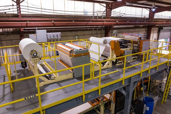 IMC laminating line unwind stand on a mezzanine platform