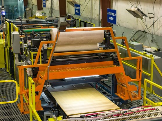 IMC laminator running kraft paper through the nip