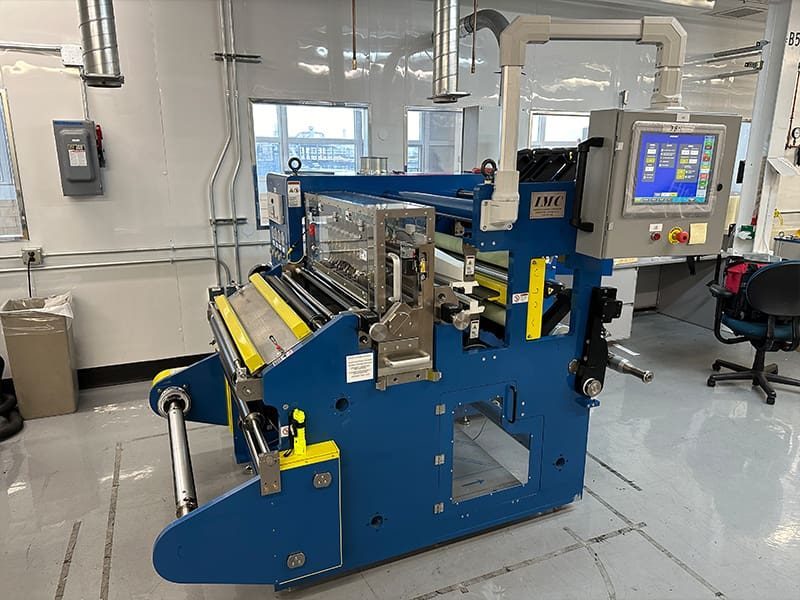 IMC slitter rewinder with cartridge slitting heads